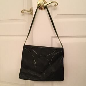 Caslon black w/ lime hints circle cut outs handbag euc like new